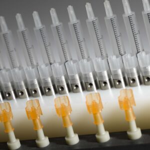 Medical device needle for surface corona treatment